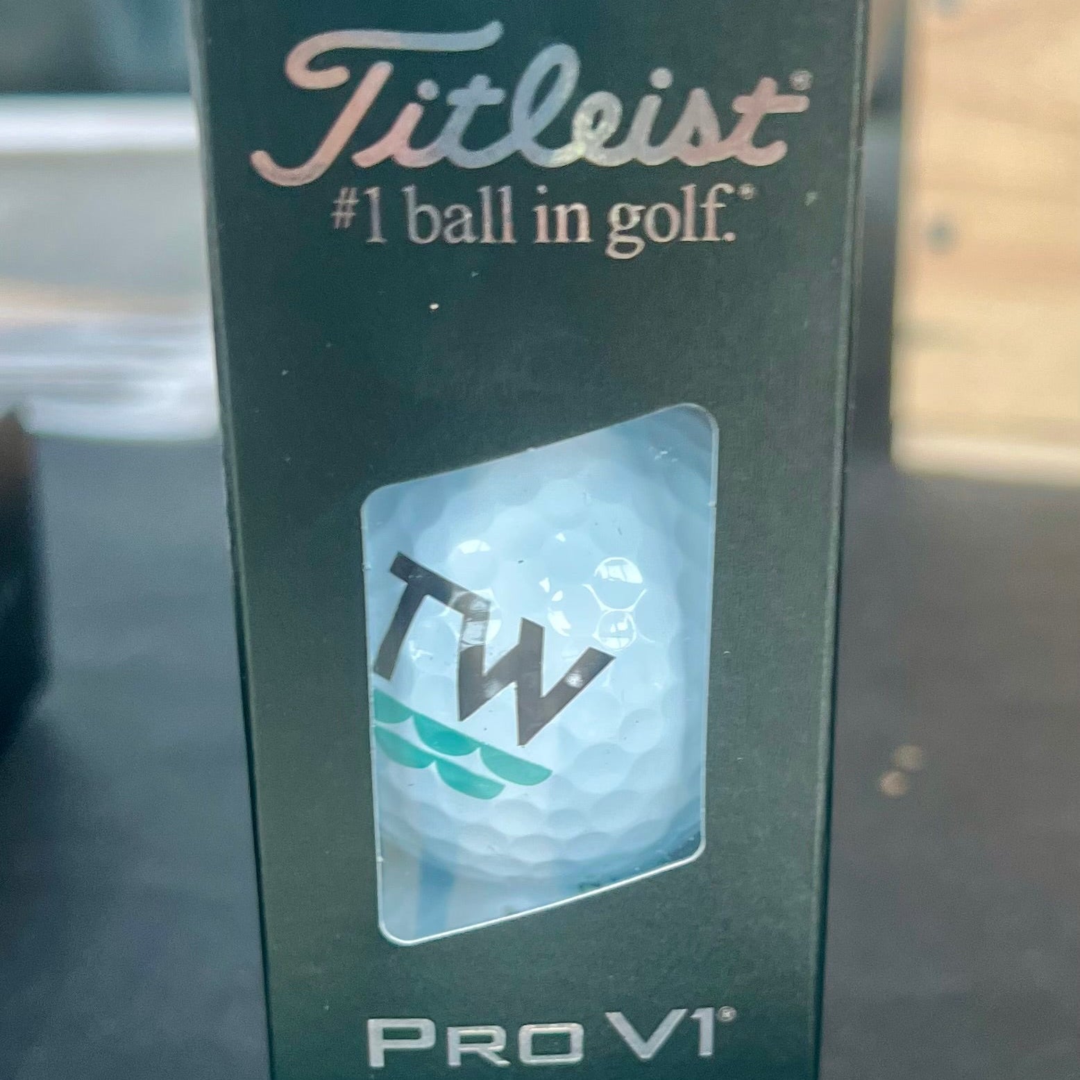 Titleist Pro V1 golf ball packaging on a dark surface